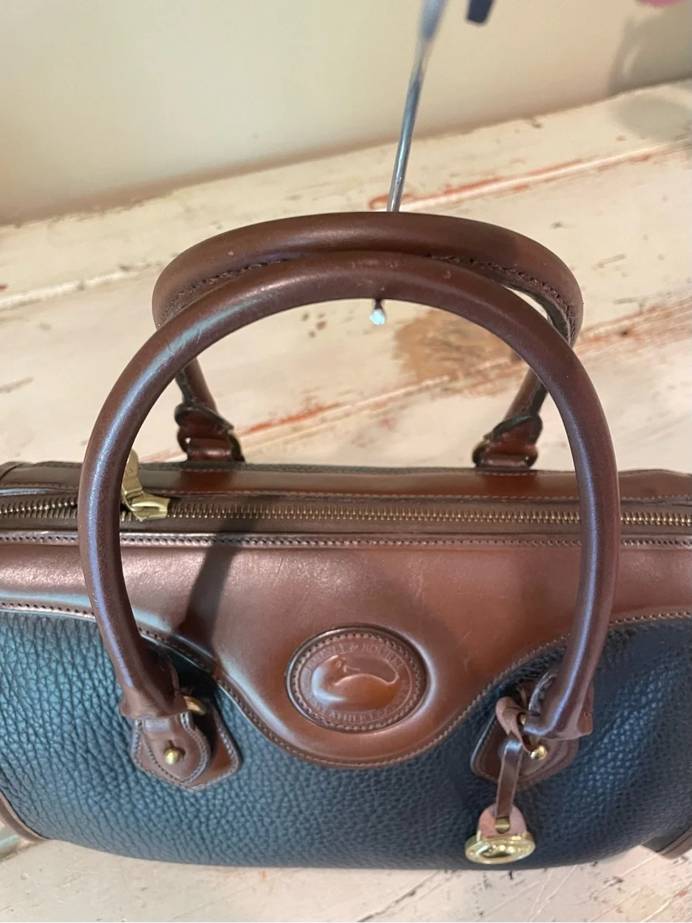 Dooney & Bourke vintage AWL Black and Brown Pebbled Leather Satchel / crossbody